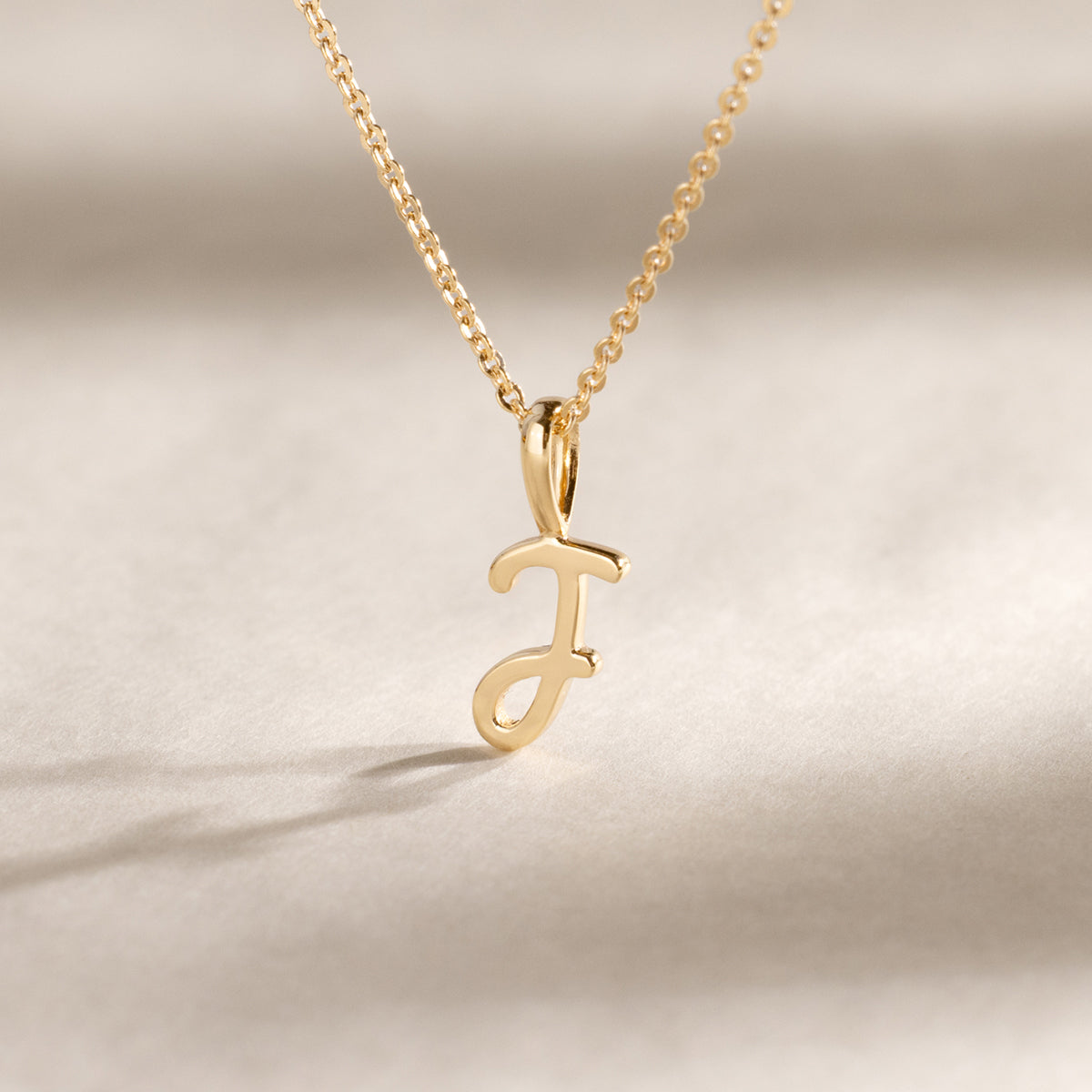 Script Initial T Charm